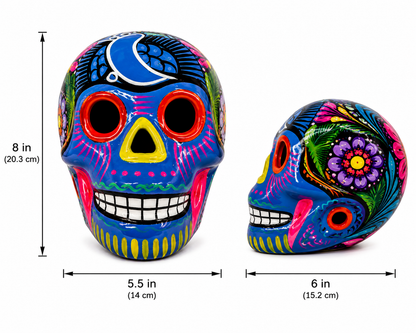 Two colorful skull figurines with measurements on a white background
