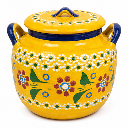 Yellow ceramic jar with floral patterns and blue accents on a white background