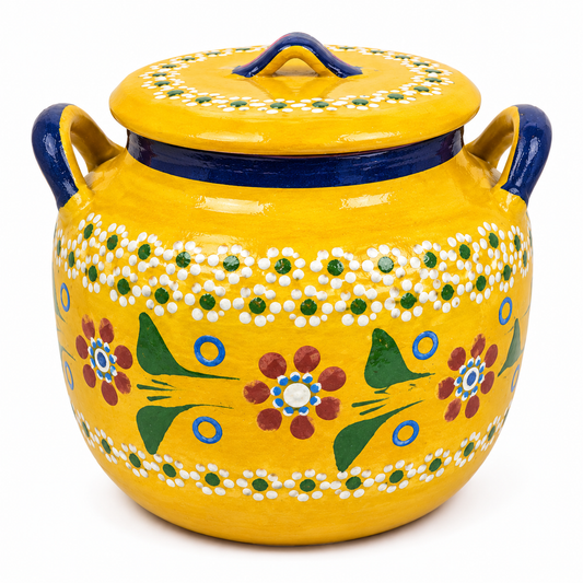Yellow ceramic jar with floral patterns and blue accents on a white background