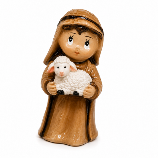 Figurine of a shepherd holding a lamb on a white background