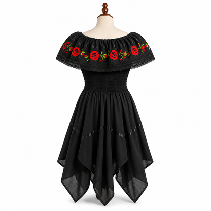 Black dress with red floral embroidery on a mannequin against a white background