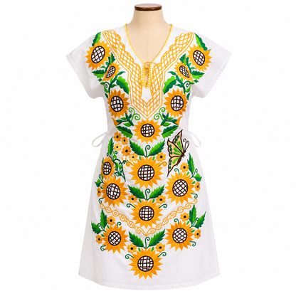 White dress with sunflower pattern on a mannequin against a white background